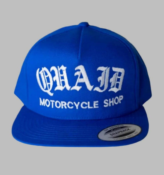 Quaid Motorcycle Shop Blue Classic Trucker Hat with white stitching for sale at Quaid Motorcycle Shop or at Quaid Harley-Davidson in Loma Linda, Ca.