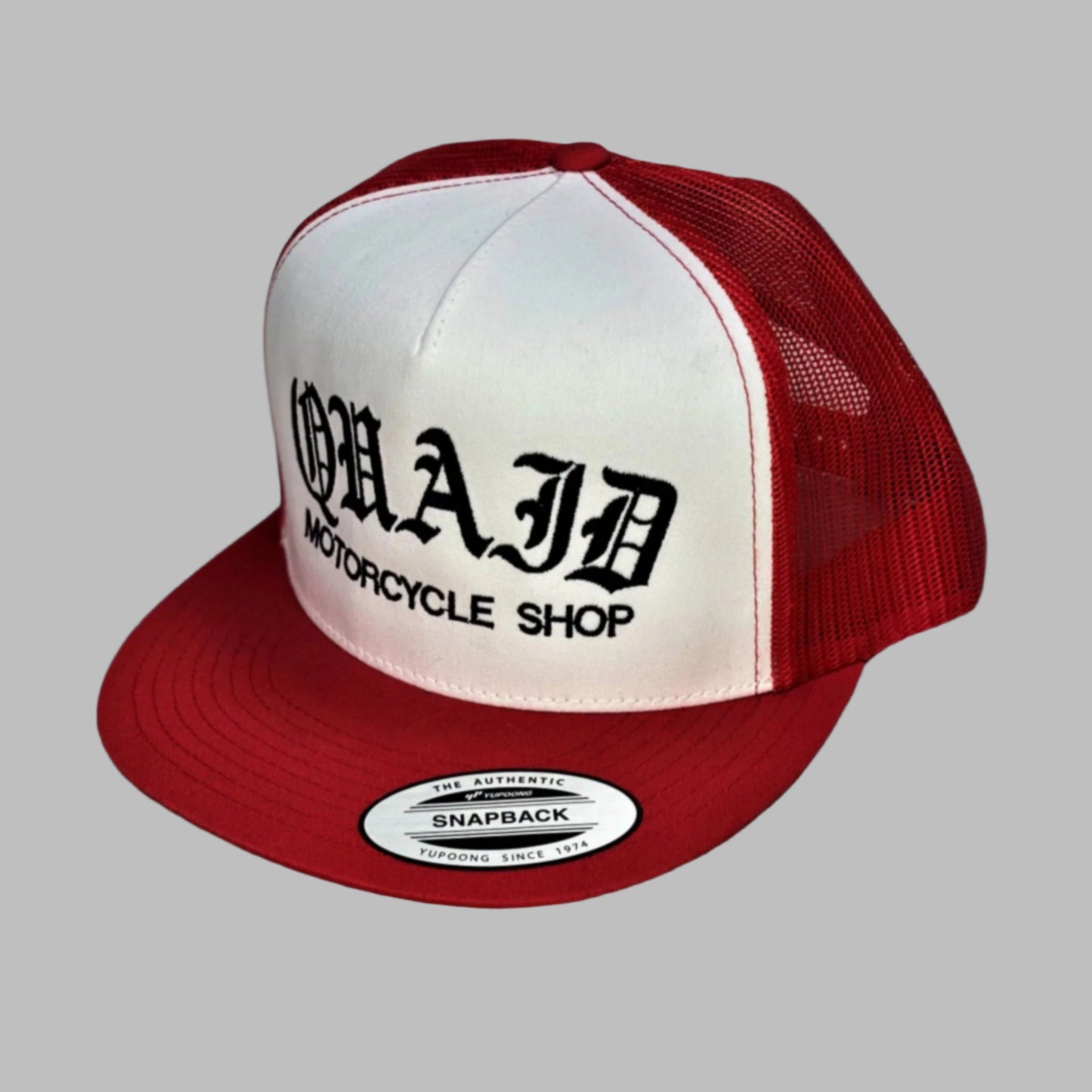 Quaid Motorcycle Shop flexfit trucker cap in two-tone red and white with black stitching for sale at Quaid Motorcycle Shop or at Quaid Harley-Davidson in Loma Linda, Ca.